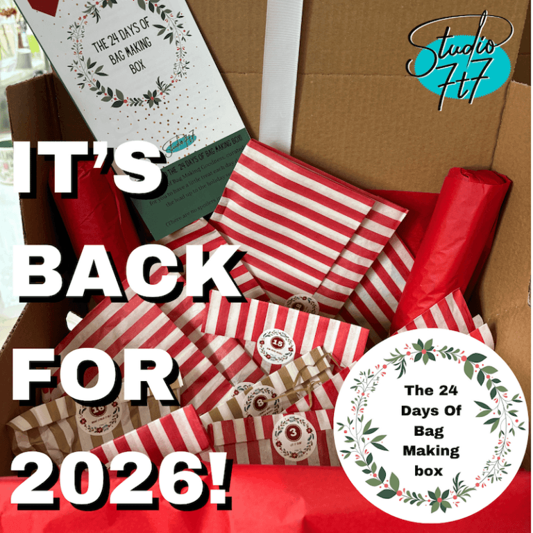 the sewing advent box for bag makers - a box of individually wrapped gifts each with a number on, some striped some plain all red packages inside a box with the 24 days of bag making log and the studio 7t7 logo on it with the words 'Its back for 2026'